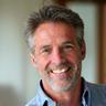 Portrait of John Doe, a happy male user